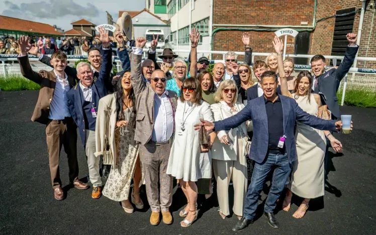 A large group of race goers at Brighton Racecourse