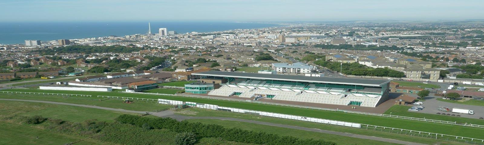 Brighton racecourse from the air with the coast in the background