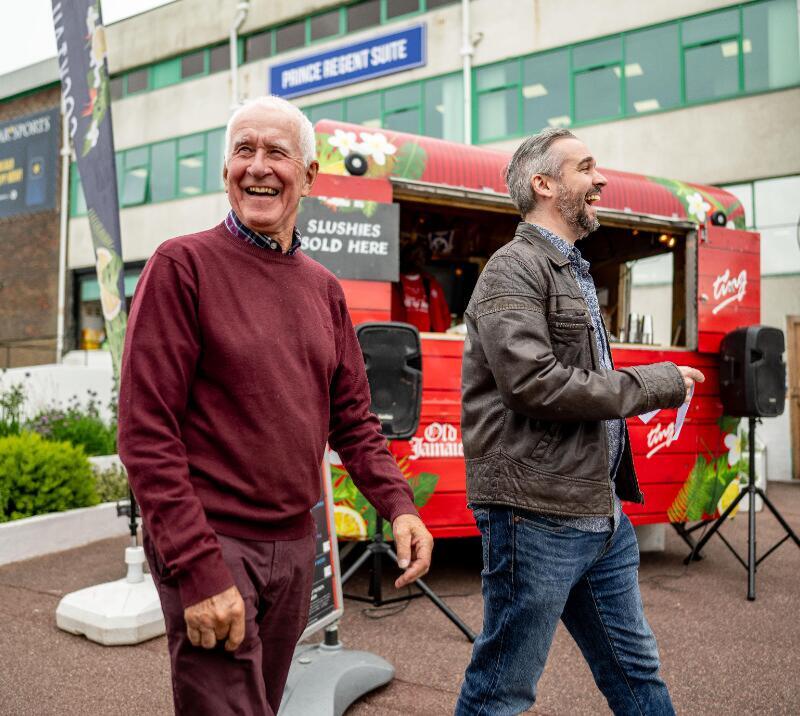 Two happy chaps walking into their race day at Brighton Races